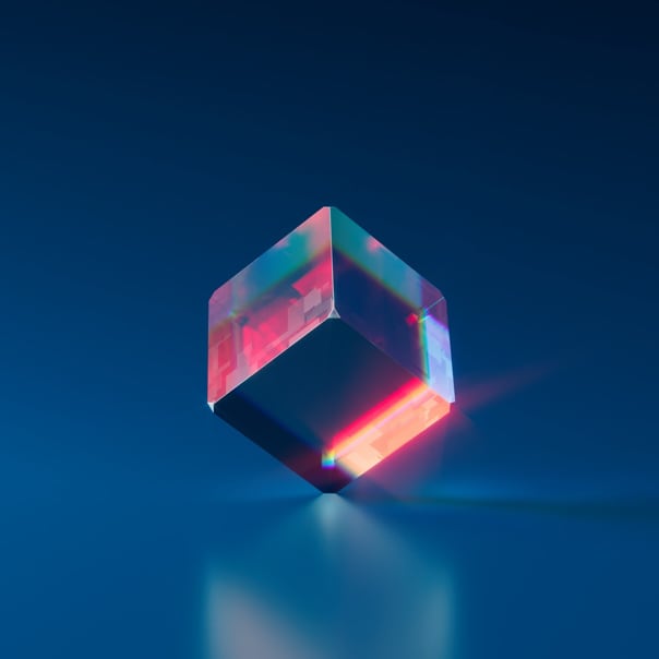 image of a glass cube balanced on one of its corners